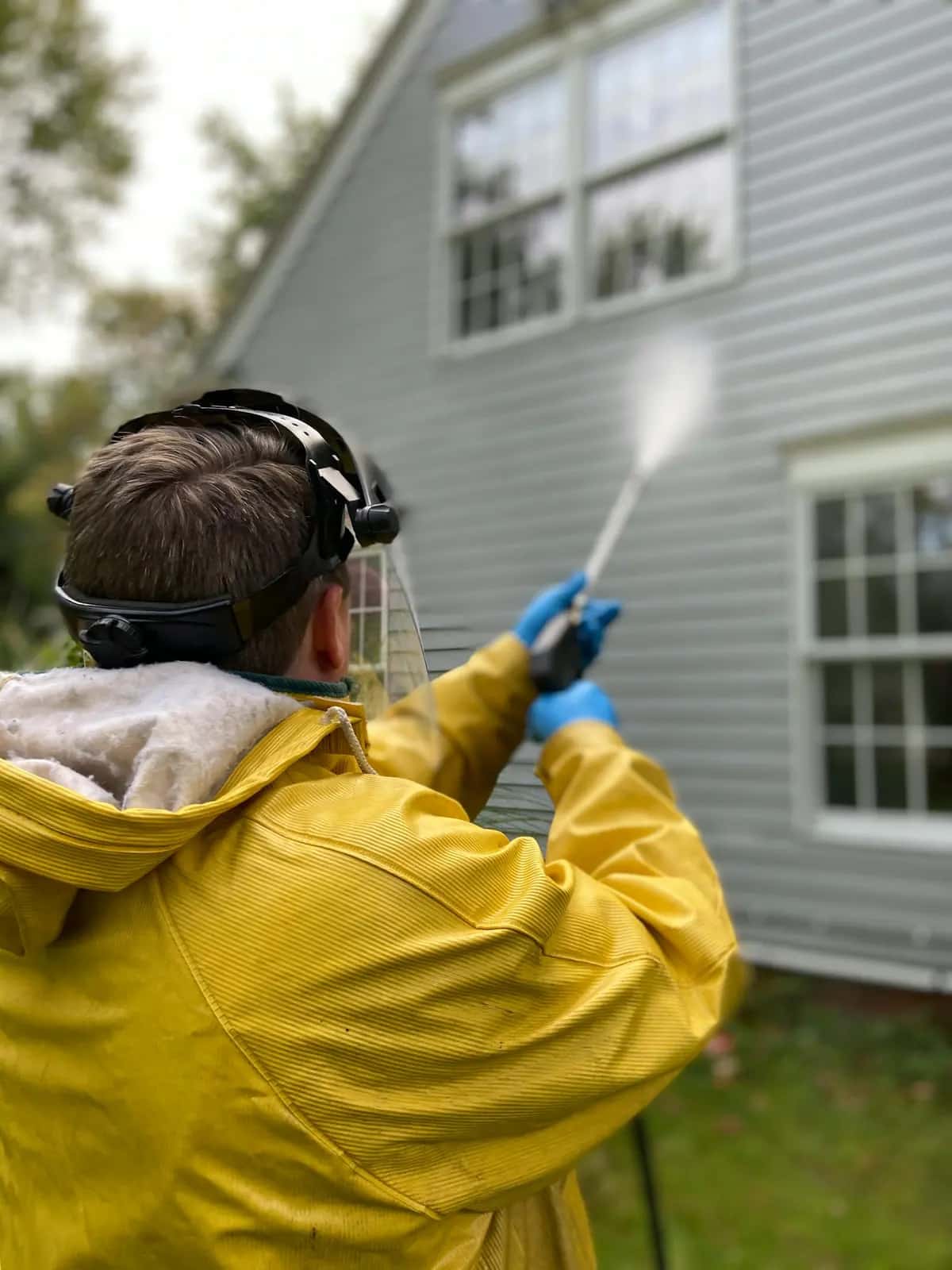 Exterior home walls pressure washed with controlled settings